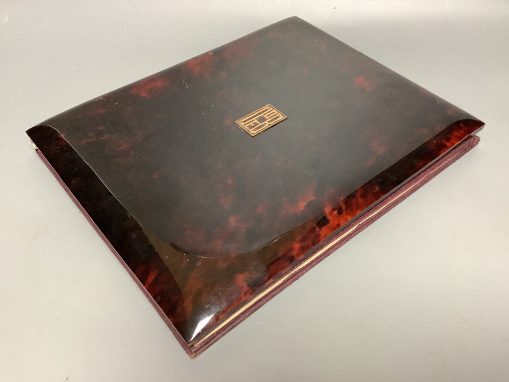 An early 20th century tortoiseshell blotter pad with yellow metal monogram, 28 x 22cm